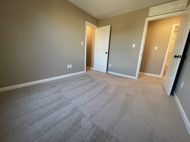 unfurnished bedroom featuring light colored carpet