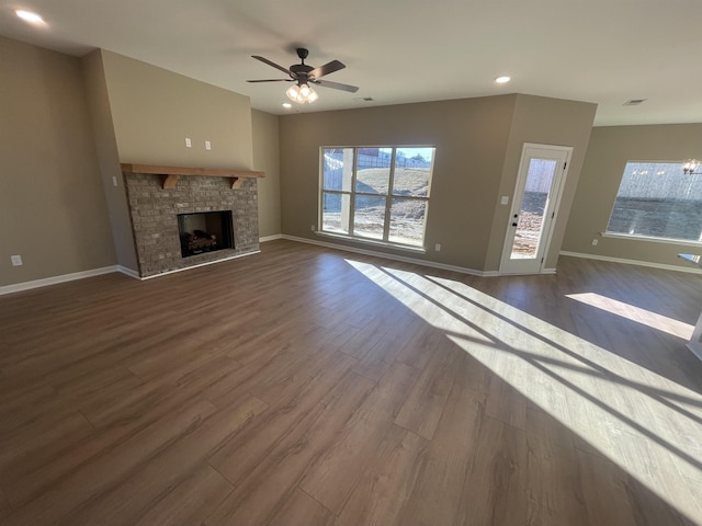 unfurnished living room with ceiling fan and dark hardwood / wood-style floors