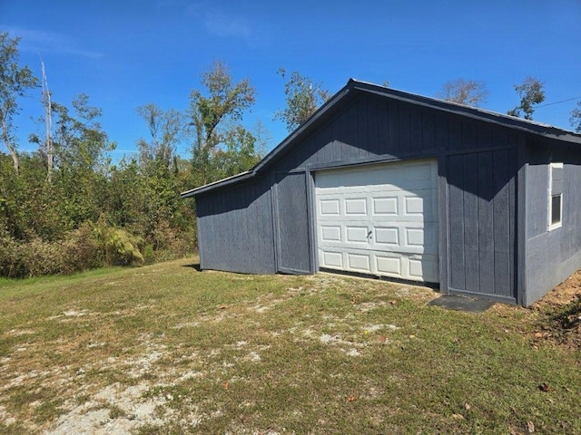 garage with a lawn