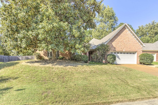 view of front facade featuring a front yard and a garage