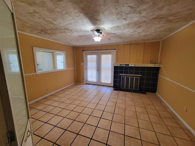 5273 Chatfield Dr Unit 5273, Memphis, TN 38116 - unfurnished living room with a ceiling fan, crown molding, french doors, light tile patterned flooring, and wainscoting