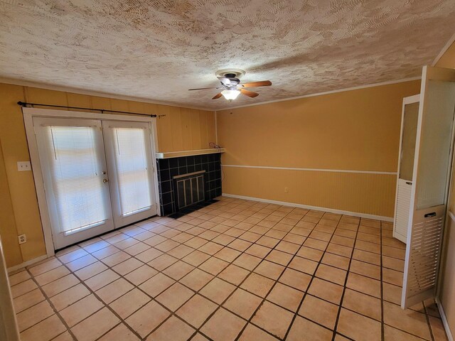 5273 Chatfield Dr Unit 5273, Memphis, TN 38116 - unfurnished room with a ceiling fan, a textured ceiling, french doors, ornamental molding, and light tile patterned floors