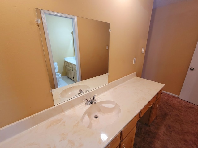 bathroom with vanity and toilet