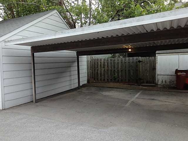 exterior space with a carport