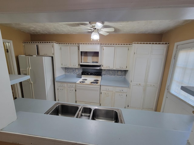 5273 Chatfield Dr Unit 5273, Memphis, TN 38116 - kitchen featuring white appliances, a sink, a ceiling fan, and white cabinets