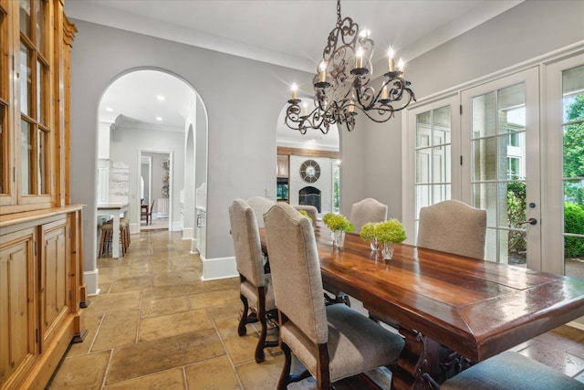 dining room with french doors and crown molding