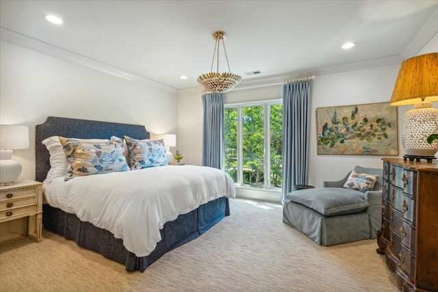 carpeted bedroom with ornamental molding