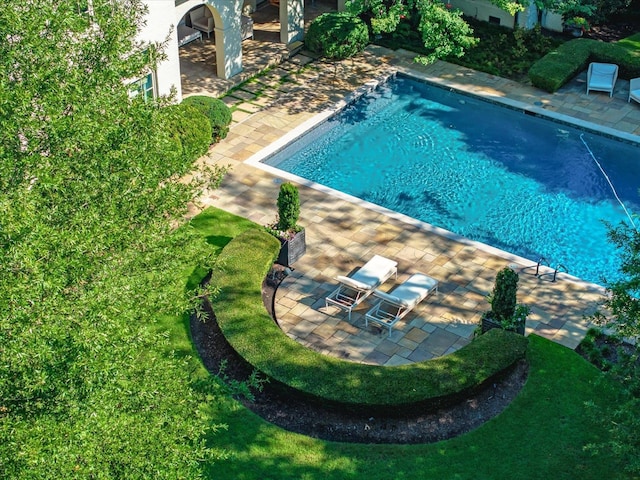 view of swimming pool featuring a patio