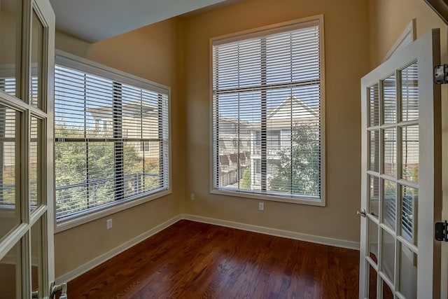 spare room featuring dark wood-type flooring