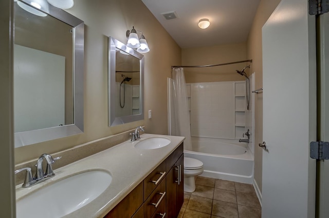 full bathroom with vanity, toilet, tile patterned floors, and shower / bath combo