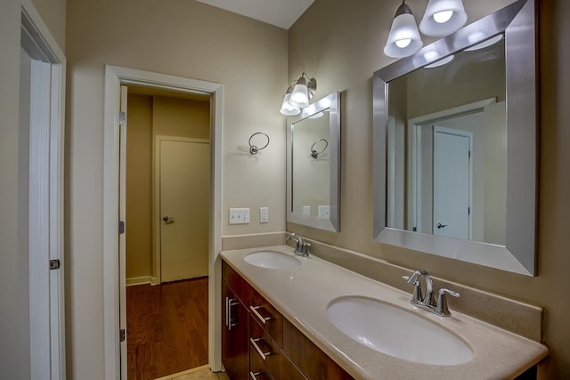 bathroom with vanity and hardwood / wood-style flooring