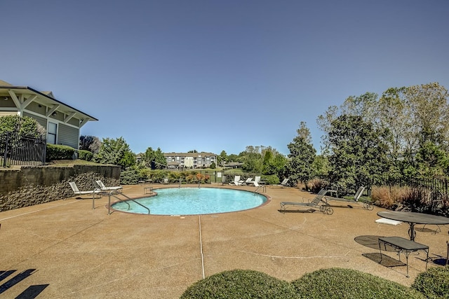 view of swimming pool with a patio