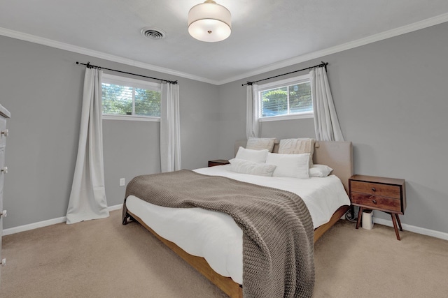 bedroom with crown molding and light carpet