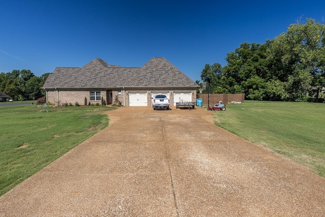 view of front of house with a front yard and a garage