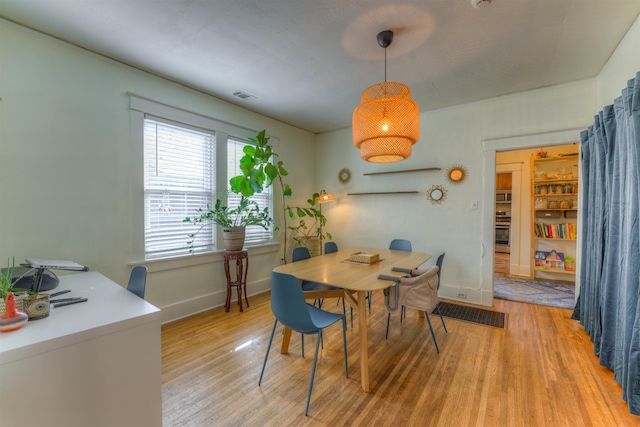 dining space featuring hardwood / wood-style flooring