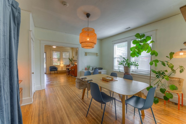 dining space with light wood-type flooring