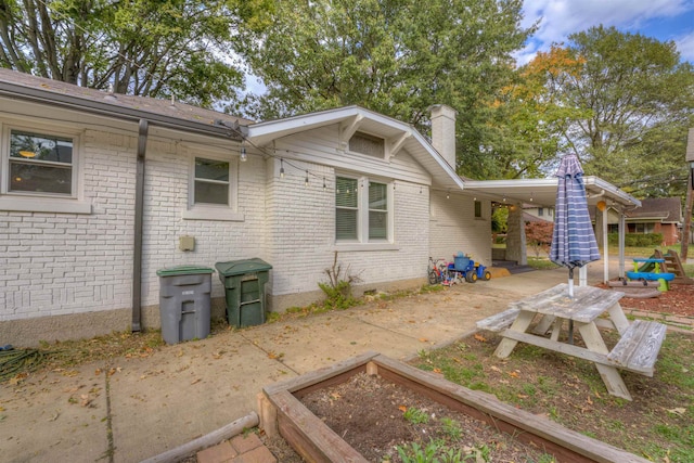 rear view of house with a patio