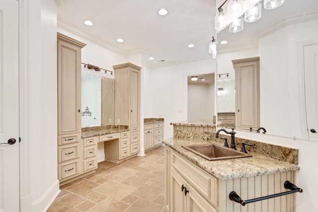 bathroom with vanity and ornamental molding