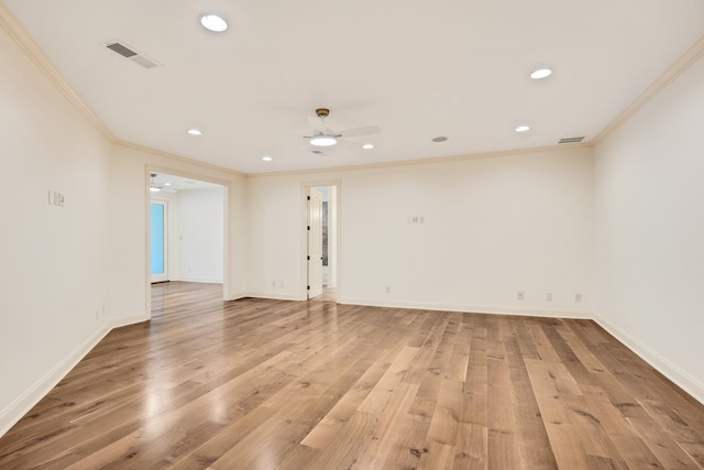 empty room featuring light wood-type flooring, crown molding, and ceiling fan