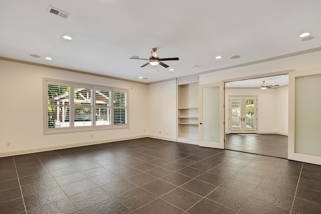 spare room featuring ornamental molding, a healthy amount of sunlight, and ceiling fan