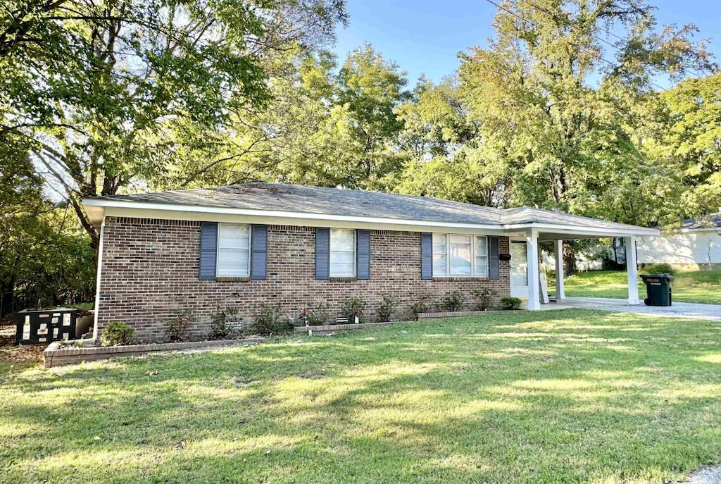 160 Miller St, Ripley, TN 38063 - single story home with brick siding, a front yard, and an attached carport