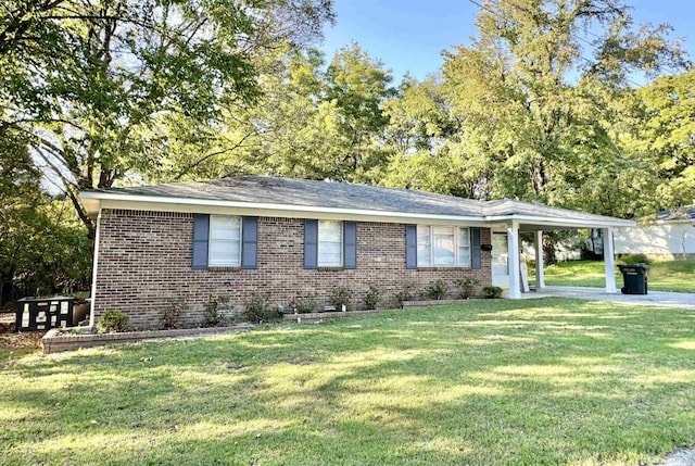 160 Miller St, Ripley, TN 38063 - single story home with brick siding, a front yard, and an attached carport