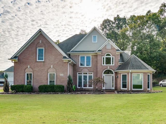 view of property featuring a front yard