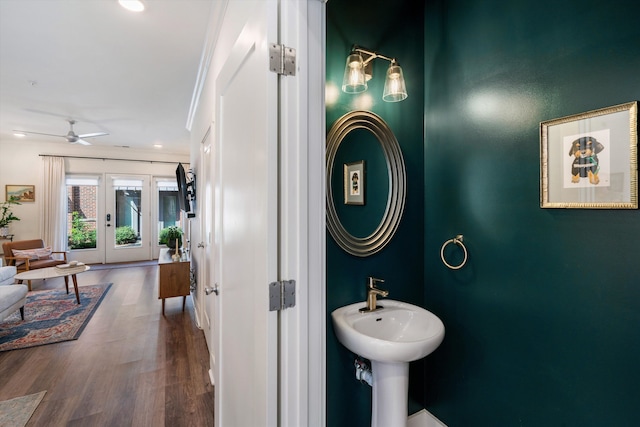 bathroom with ceiling fan, hardwood / wood-style flooring, crown molding, and french doors