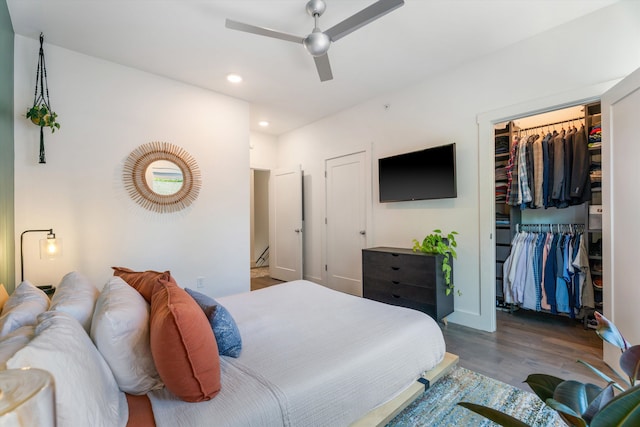 bedroom with ceiling fan and wood-type flooring