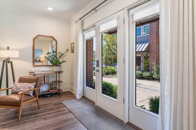 doorway to outside with ornamental molding, hardwood / wood-style floors, and french doors