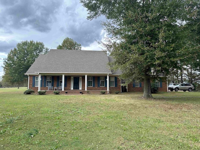 view of front of house featuring a porch and a front yard