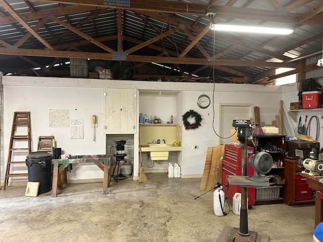 garage featuring sink and a workshop area