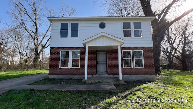 front facade with a front lawn