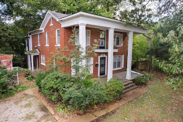 greek revival inspired property featuring covered porch