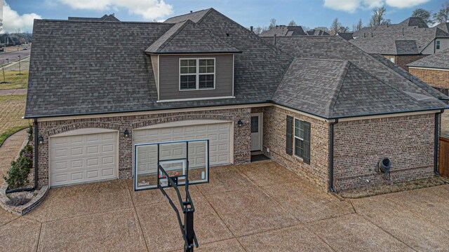 view of side of property with a garage