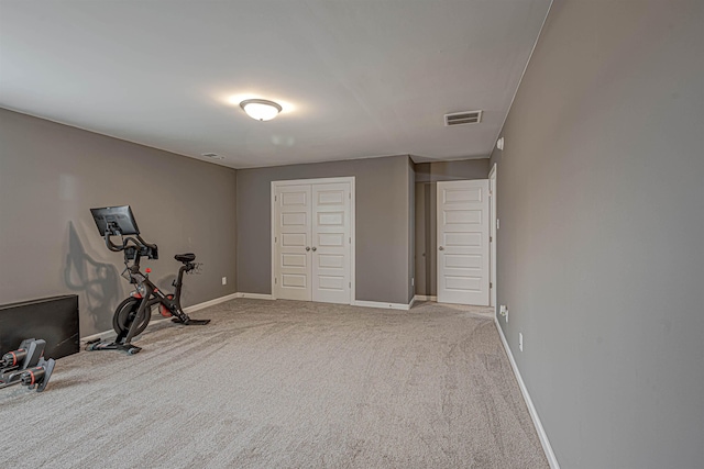 workout area featuring carpet flooring