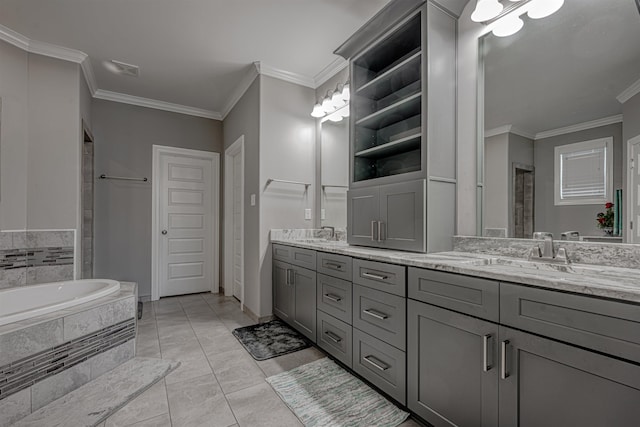 bathroom with tiled bath, tile patterned flooring, crown molding, and vanity