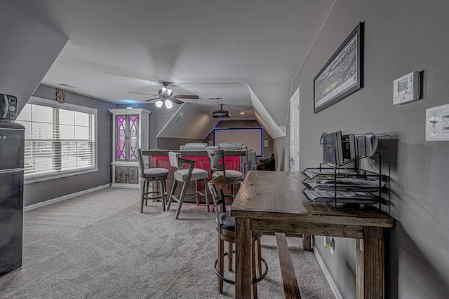 home office featuring light carpet and ceiling fan