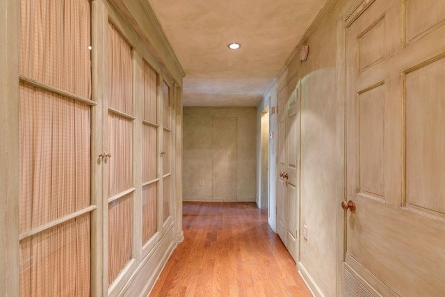 corridor featuring recessed lighting and light wood-style flooring