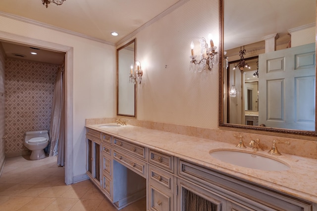 bathroom featuring vanity, crown molding, tile patterned floors, and toilet