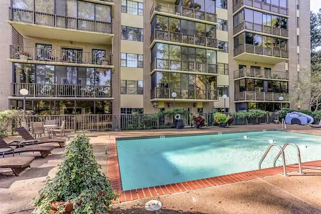 view of swimming pool featuring a patio area