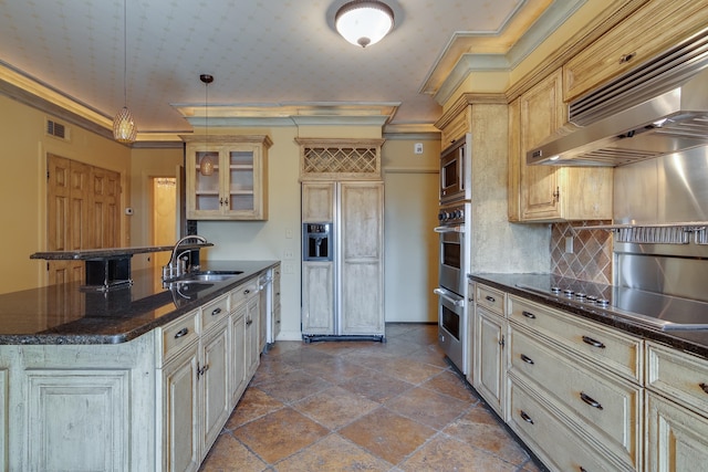 kitchen with sink, crown molding, built in appliances, ventilation hood, and decorative light fixtures