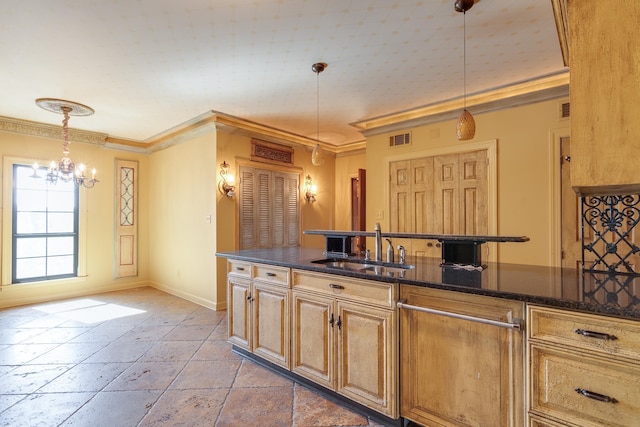 kitchen with sink, crown molding, dark stone countertops, decorative light fixtures, and a chandelier