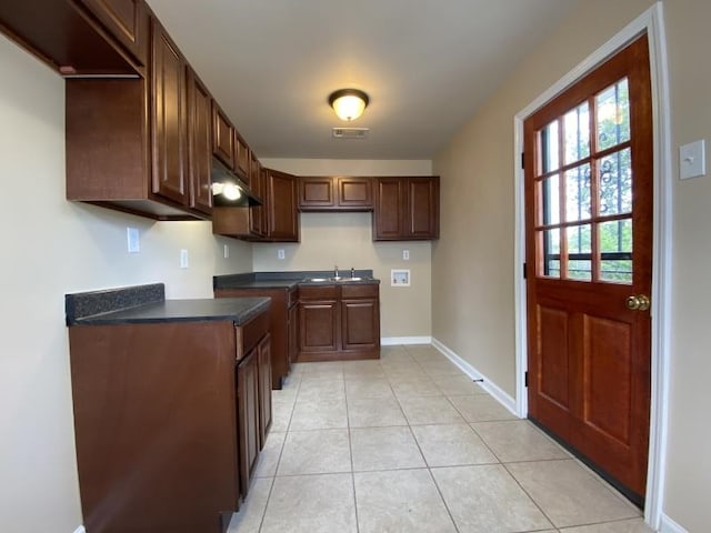 kitchen with sink and light tile patterned floors