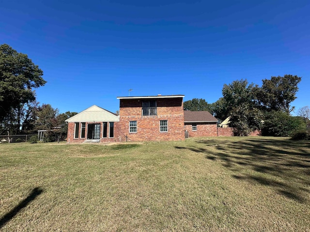 back of house with a yard