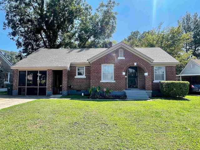 ranch-style home with a front lawn