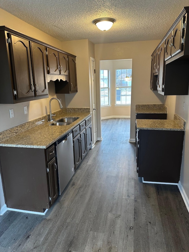 kitchen with dishwasher, sink, dark hardwood / wood-style floors, a textured ceiling, and dark brown cabinetry