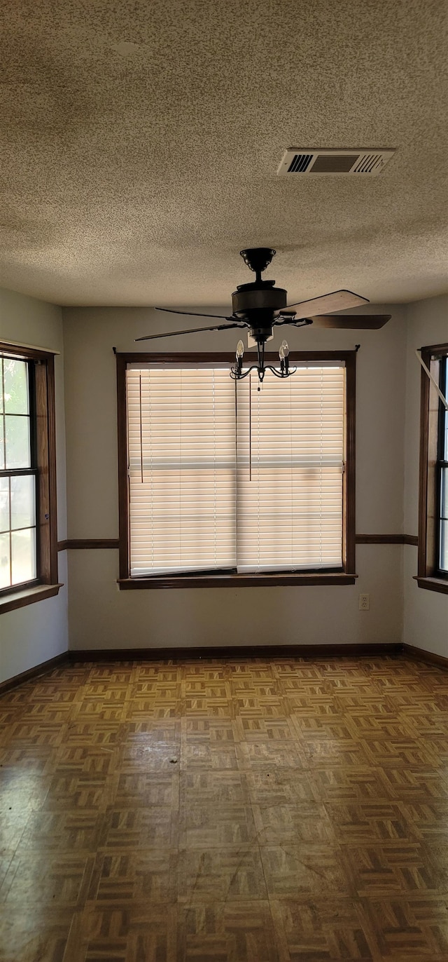 empty room with a textured ceiling