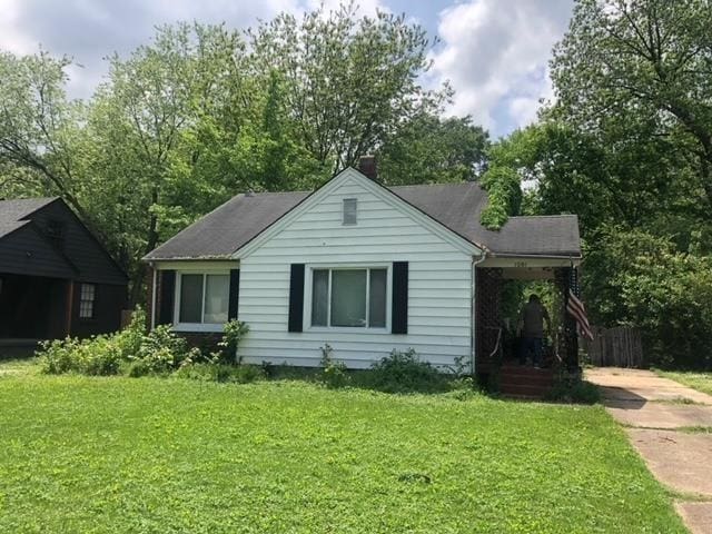 view of home's exterior with a yard