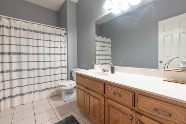 bathroom with vanity, tile patterned floors, and toilet